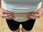 FATLAB warming body patch showing visible center color change after several hours of wear on the lower abdomen