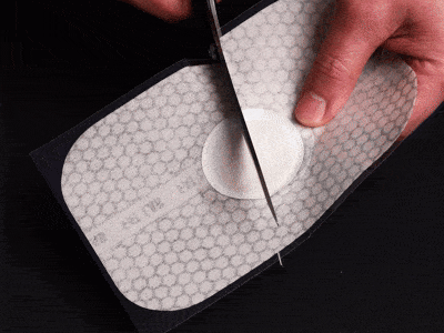Close-up video of the FATLAB warming body patch interior showing powder technology and ingredient layers used for skin tightening toning and body care